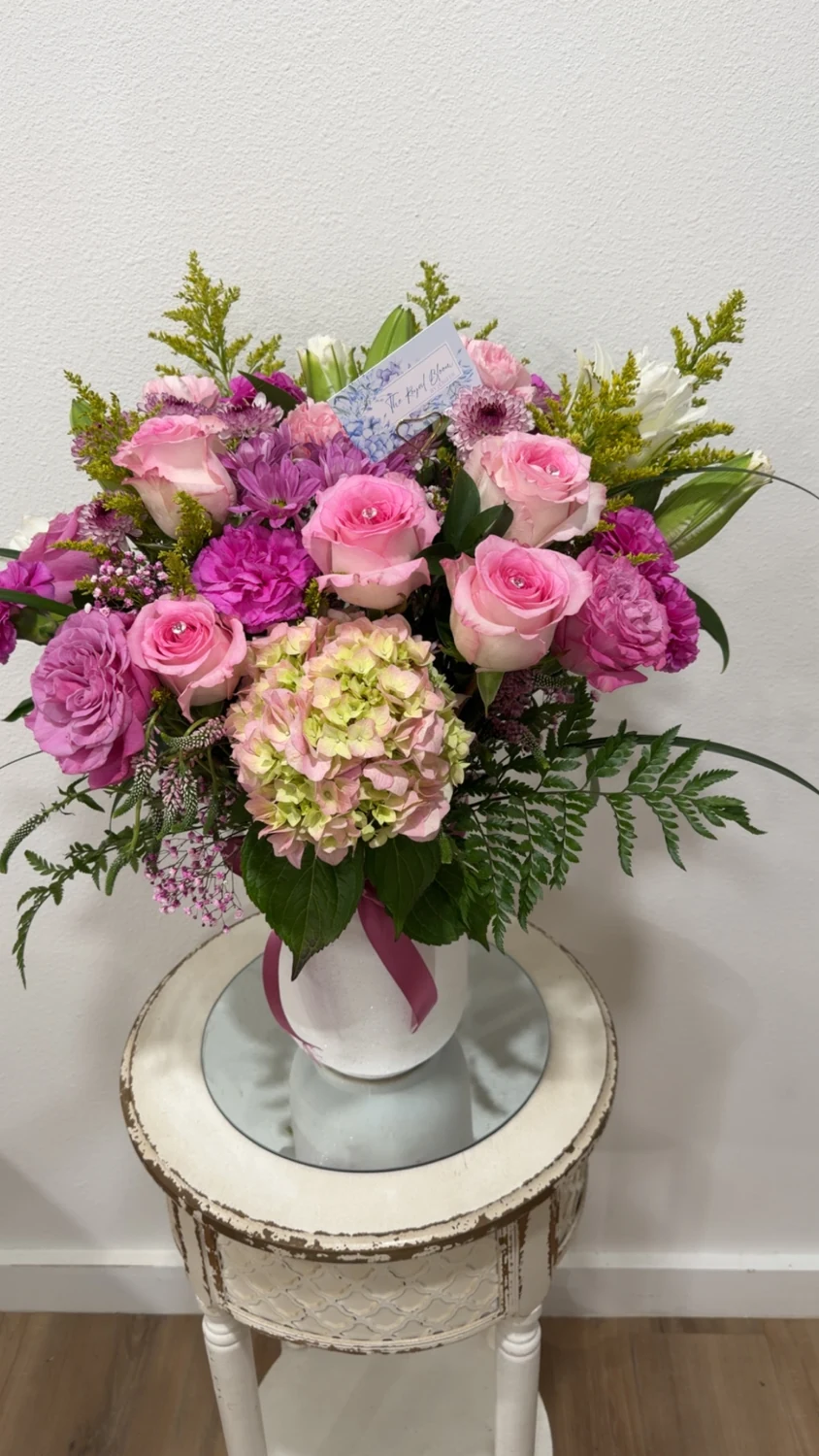 Pink roses and hydrangea arranged in a vase