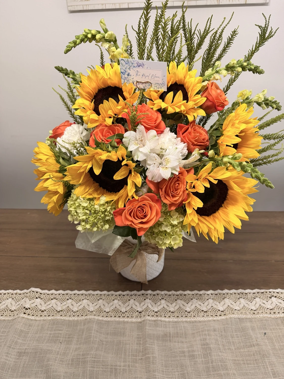 Sunflower and orange floral arrangement