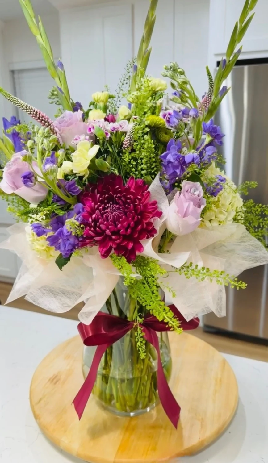 Purple, pink, and green seasonal flowers